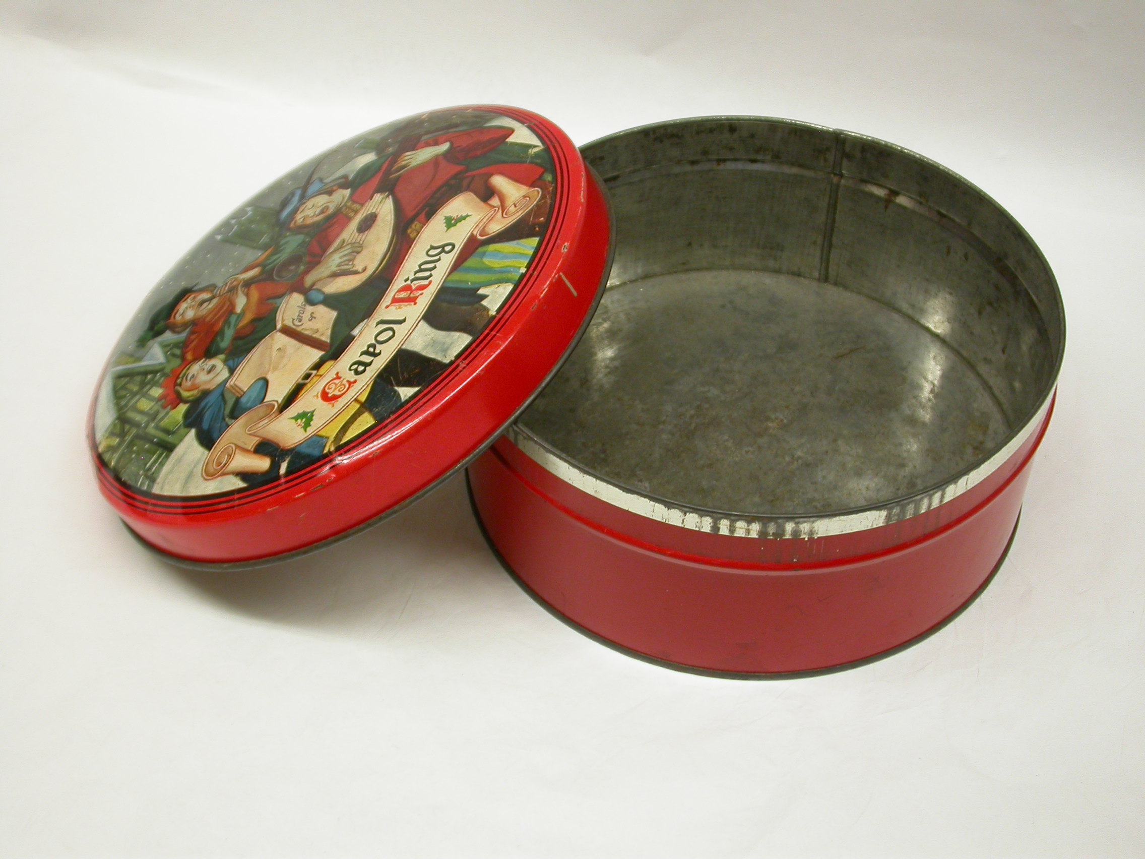a%20round%2C%20red-coloured%20cookie%20tin%20with%20Christmas%20scene%20on%20lid